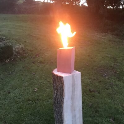 Redwood Swedish Candle Lit on Ash Stand